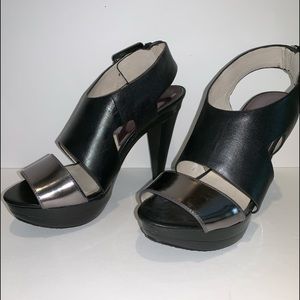 Michael Kors 4.5” black heels with silver strap.